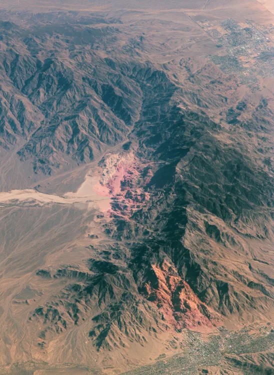 Rocky mountain ridge in dusty pink evening light